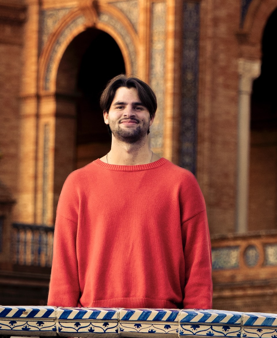 Andre standing in front of a historic building in Florence